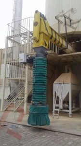 Bulk material loading spout for trucks